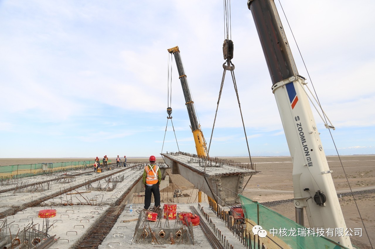 【公司动态】中核甘肃核技术产业园进厂道路跨嘉策铁路大桥箱梁安装