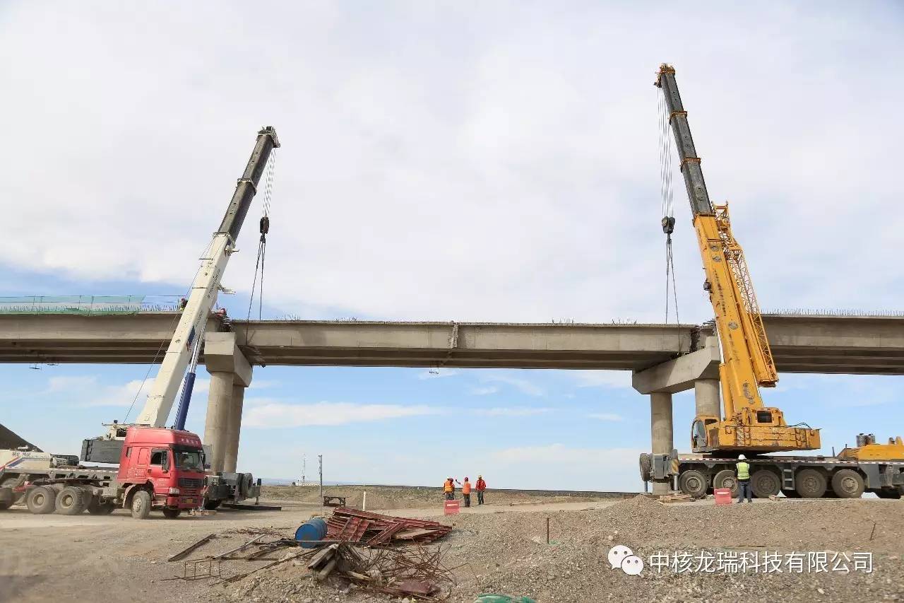 公司動態中核甘肅核技術產業園進廠道路跨嘉策鐵路大橋箱梁安裝順利